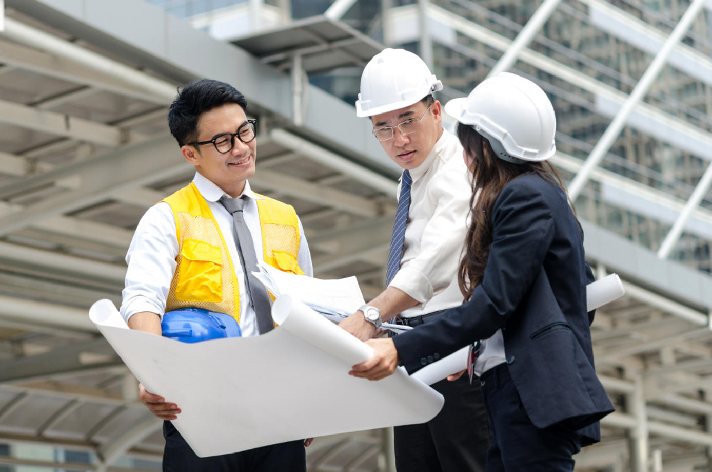 Asian architect discussing about the project as the result of RPO recruitment process