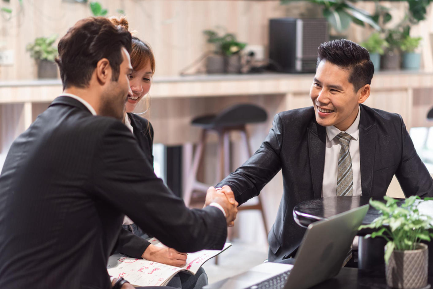 three people happy after a successful recruitment process