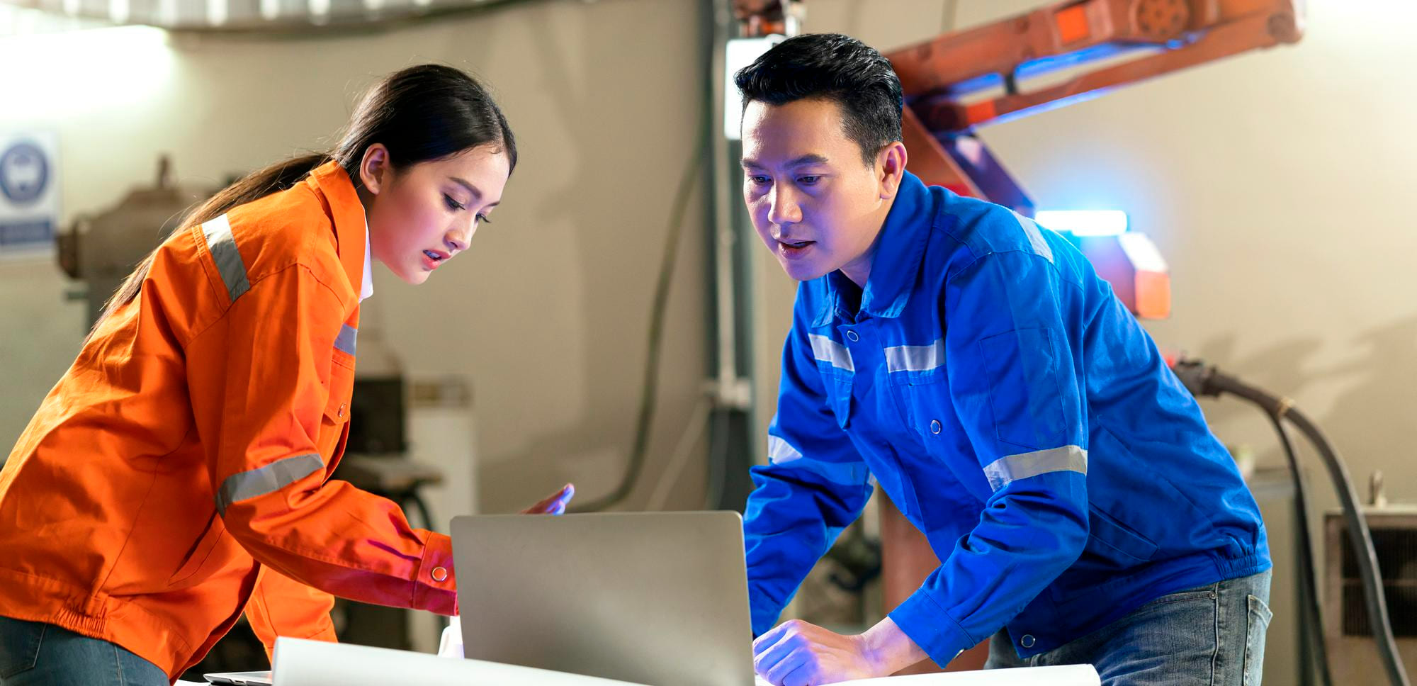 Two labor outsourcing construction workers discuss working plan