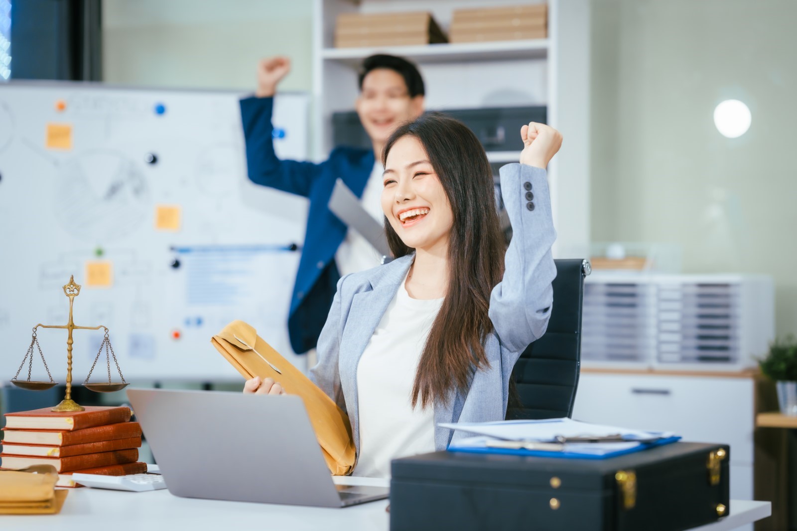 Female office worker smiling because she is satisfied and happy with her work 