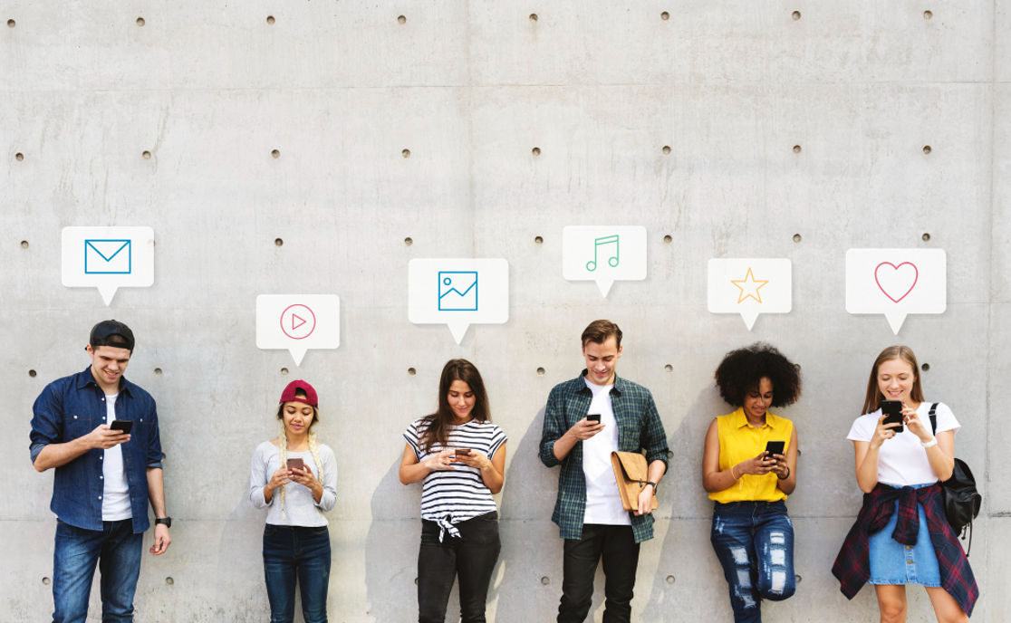 A group of people using phones to find job and career tips on social media