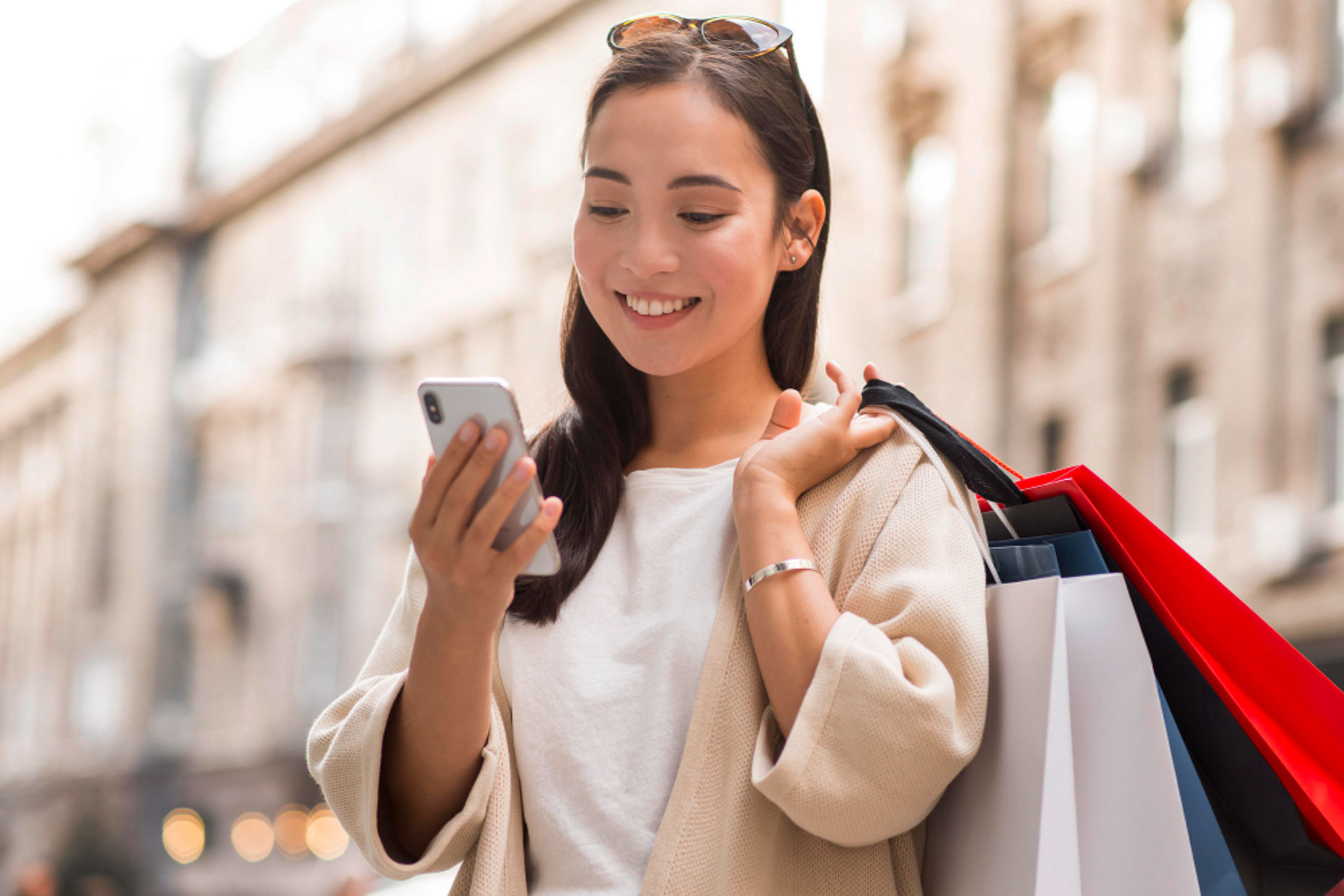 Asian consumer go shopping smiling at phone