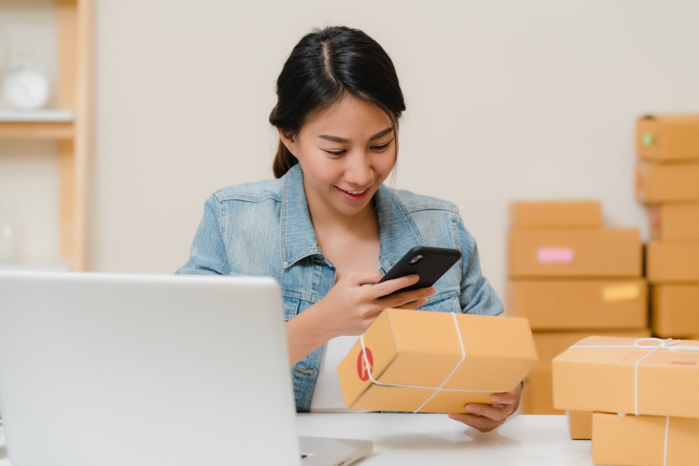 An e-commerce employee checking the packages in her office