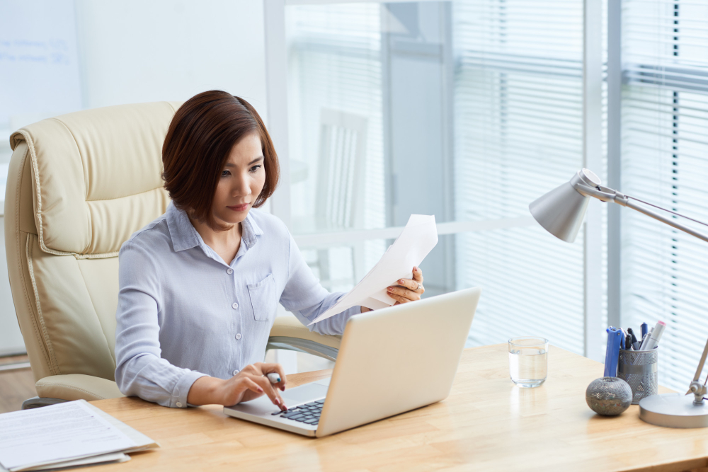 Manpower's accountant calculating salary and tax for their clients who use the staffing service.