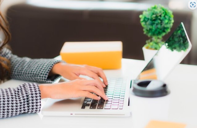 After the job interview, the candidate sits down to compose an email to thank the employer