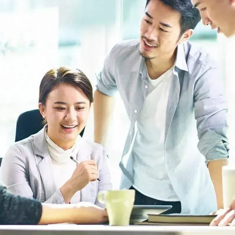 an industry consultation of a male career expert in bright shirt with a female qualified candidate in HR consulting recruitment services process